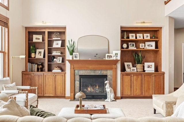 9256 Gateway Ln, Eden Prairie, MN 55347 - living room with light colored carpet, a fireplace, and a towering ceiling