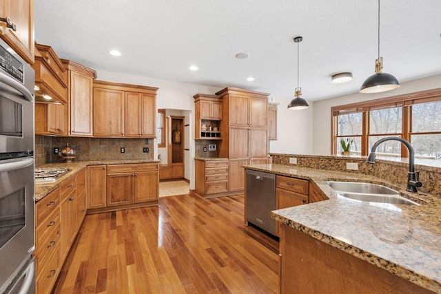 9256 Gateway Ln, Eden Prairie, MN 55347 - kitchen featuring a sink, stainless steel dishwasher, light wood finished floors, tasteful backsplash, and recessed lighting