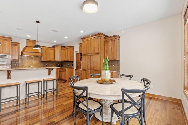 9256 Gateway Ln, Eden Prairie, MN 55347 - dining space with wood finished floors, recessed lighting, and baseboards