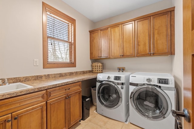9256 Gateway Ln, Eden Prairie, MN 55347 - laundry room featuring cabinet space, independent washer and dryer, and light tile patterned floors
