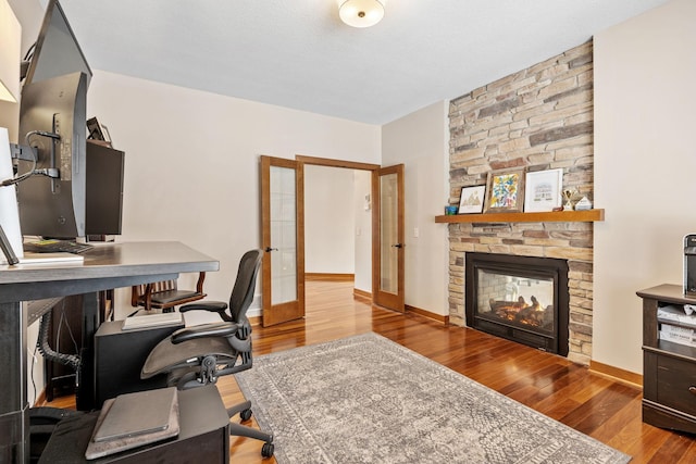 9256 Gateway Ln, Eden Prairie, MN 55347 - office space featuring french doors, wood finished floors, a fireplace, and baseboards