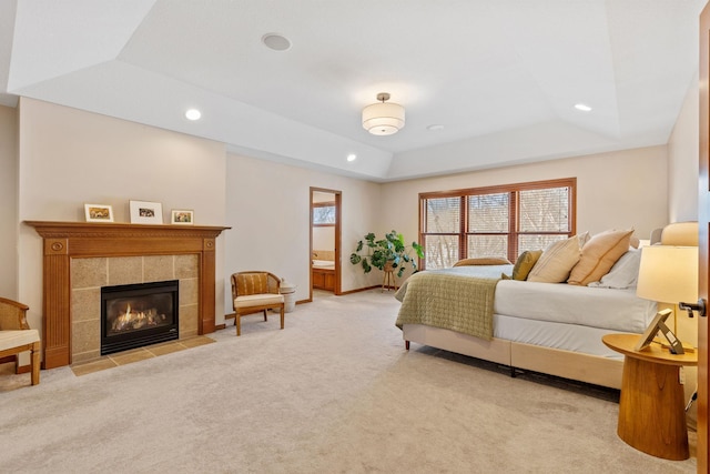 9256 Gateway Ln, Eden Prairie, MN 55347 - bedroom featuring a raised ceiling, carpet flooring, recessed lighting, a tile fireplace, and baseboards