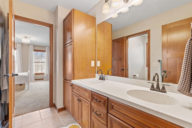9256 Gateway Ln, Eden Prairie, MN 55347 - bathroom with double vanity, tile patterned floors, and baseboards