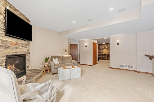 9256 Gateway Ln, Eden Prairie, MN 55347 - living room with a fireplace, light colored carpet, and baseboards