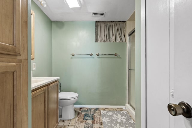1989 Park Dr, Saint Paul, MN 55119 - bathroom with a shower stall, vanity, and tile patterned floors