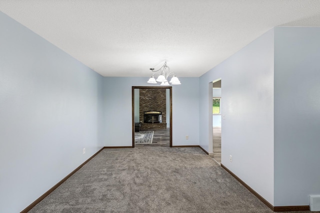 1989 Park Dr, Saint Paul, MN 55119 - carpeted spare room with a chandelier and a textured ceiling