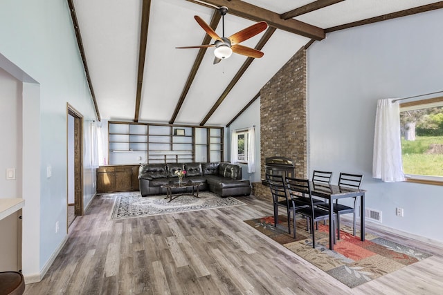 1989 Park Dr, Saint Paul, MN 55119 - living area featuring beamed ceiling, wood finished floors, high vaulted ceiling, and ceiling fan