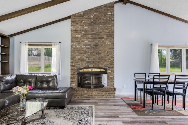 1989 Park Dr, Saint Paul, MN 55119 - living area with beam ceiling, wood finished floors, plenty of natural light, high vaulted ceiling, and a brick fireplace