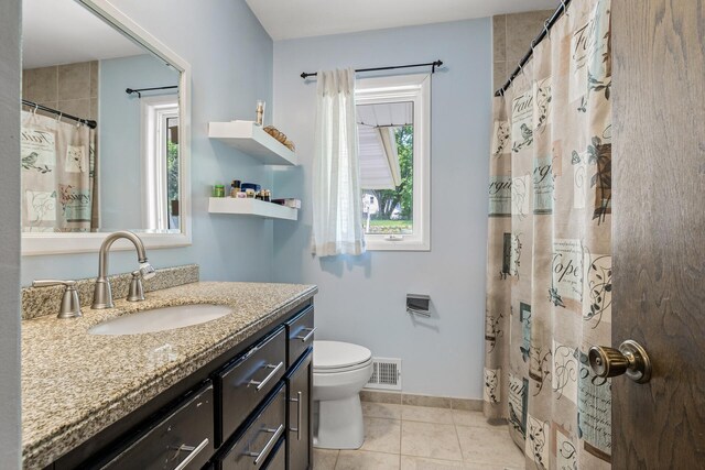 1989 Park Dr, Saint Paul, MN 55119 - bathroom with vanity, tile patterned floors, and a shower with shower curtain