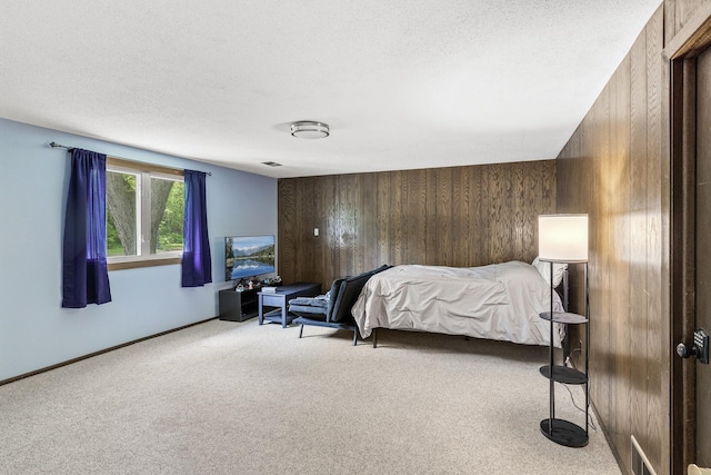 1989 Park Dr, Saint Paul, MN 55119 - bedroom featuring carpet flooring, wood walls, and a textured ceiling