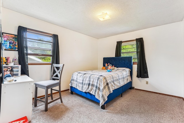 1261 Leland Rd E, Maplewood, MN 55109 - bedroom featuring light colored carpet, a textured ceiling, and baseboards
