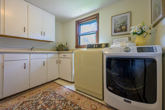 21400 654th Ave, Darwin, MN 55324 - laundry room with cabinet space, independent washer and dryer, and a textured ceiling