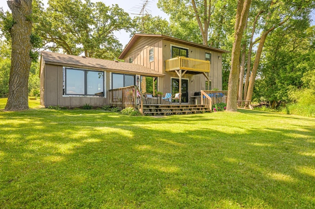 21400 654th Ave, Darwin, MN 55324 - rear view of house featuring a balcony, a lawn, a deck, and a shingled roof