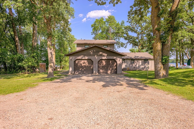21400 654th Ave, Darwin, MN 55324 - view of front of house with dirt driveway, a front lawn, and a garage