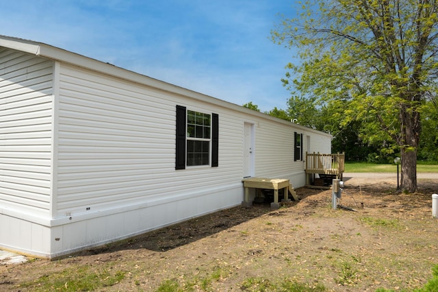 215 Mckay Ave # 59, Alexandria, MN 56308 - view of property exterior featuring a wooden deck