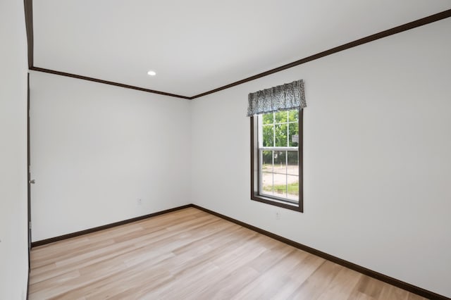 215 Mckay Ave # 59, Alexandria, MN 56308 - unfurnished room featuring crown molding, light wood finished floors, baseboards, and recessed lighting