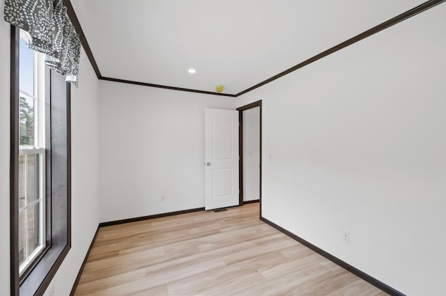 215 Mckay Ave # 59, Alexandria, MN 56308 - empty room with ornamental molding, light wood finished floors, baseboards, and recessed lighting