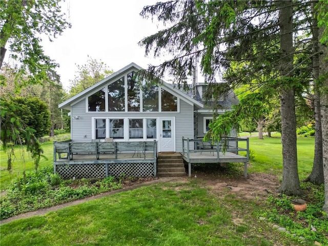 17174 59th Ave, Lafayette Twp, WI 54729 - back of property with a yard and a deck