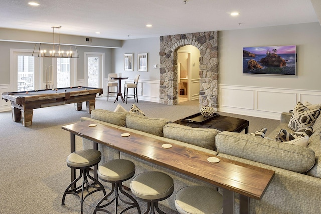 2670 Kelley Pkwy Unit 115, Orono, MN 55356 - carpeted living room with arched walkways, a decorative wall, wainscoting, pool table, and recessed lighting