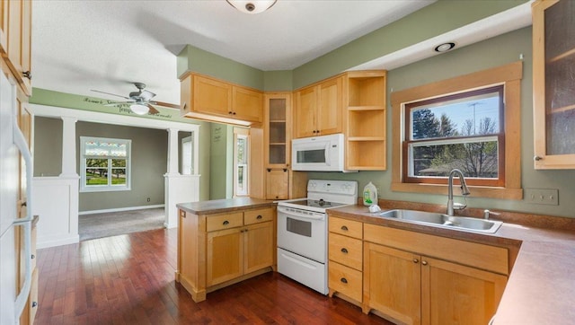 1125 9th Ave SE, Saint Cloud, MN 56304 - kitchen with white appliances, a sink, a peninsula, and glass insert cabinets
