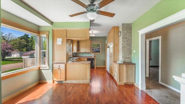 1125 9th Ave SE, Saint Cloud, MN 56304 - kitchen featuring light brown cabinetry, freestanding refrigerator, hardwood / wood-style floors, a sink, and a ceiling fan