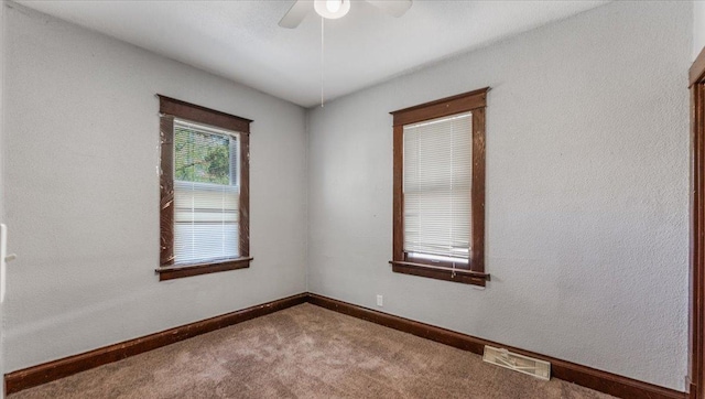 1125 9th Ave SE, Saint Cloud, MN 56304 - unfurnished room featuring a ceiling fan, carpet flooring, and baseboards