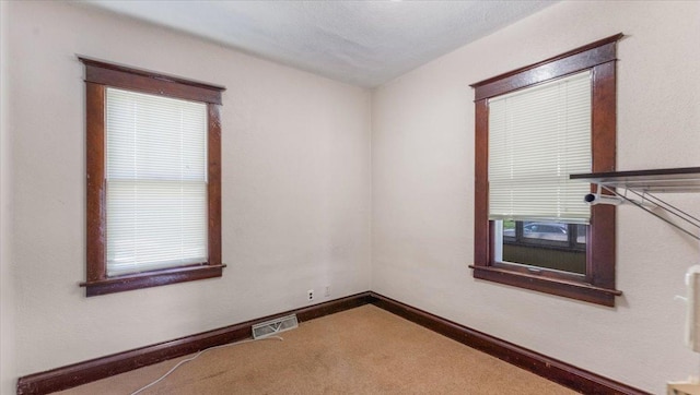 1125 9th Ave SE, Saint Cloud, MN 56304 - unfurnished room featuring carpet flooring and baseboards