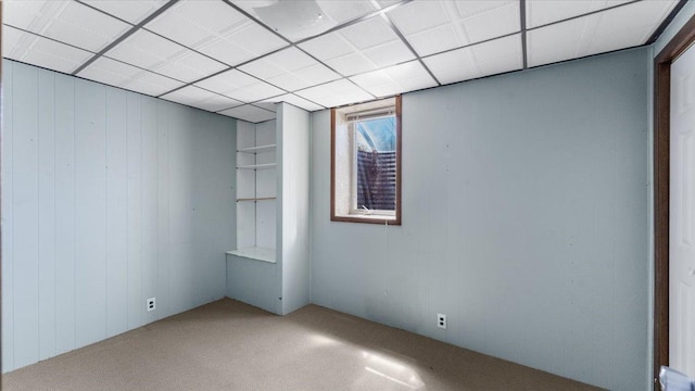 1125 9th Ave SE, Saint Cloud, MN 56304 - carpeted spare room featuring wooden walls