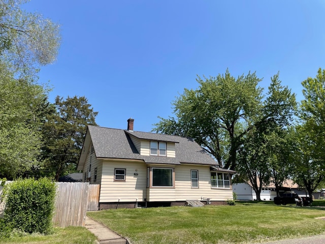 1125 9th Ave SE, Saint Cloud, MN 56304 - back of property featuring a chimney and a shingled roof