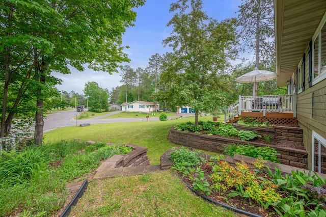 1501 Fraser Dr, Grand Rapids, MN 55744 - view of grassy yard with a wooden deck