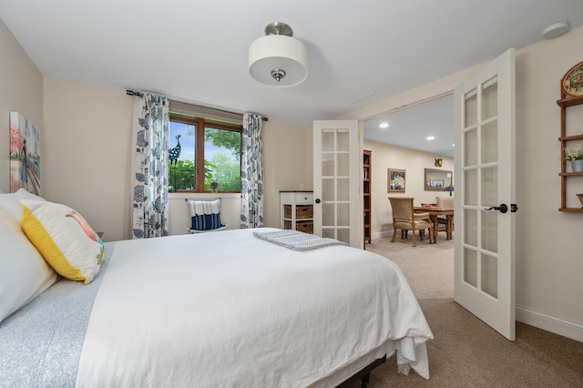 1501 Fraser Dr, Grand Rapids, MN 55744 - bedroom featuring french doors, carpet, baseboards, and recessed lighting