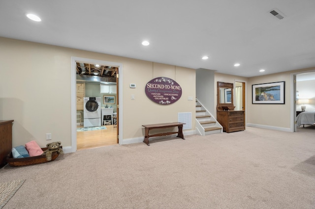 1501 Fraser Dr, Grand Rapids, MN 55744 - recreation room featuring carpet, washer / clothes dryer, baseboards, and recessed lighting
