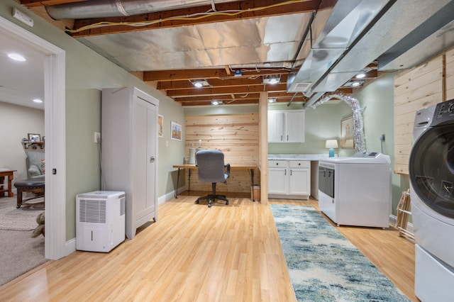 1501 Fraser Dr, Grand Rapids, MN 55744 - washroom featuring cabinet space, a desk, light wood finished floors, wooden walls, and baseboards