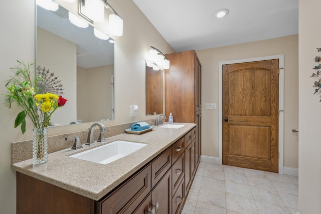 1501 Fraser Dr, Grand Rapids, MN 55744 - full bath featuring double vanity, baseboards, and tile patterned floors