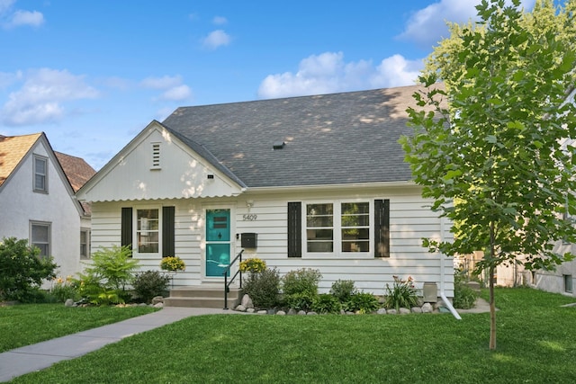 5409 Aldrich Ave S, Minneapolis, MN 55419 - view of front of home featuring a front lawn and a shingled roof