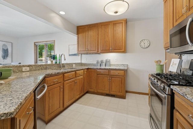 5409 Aldrich Ave S, Minneapolis, MN 55419 - kitchen featuring stainless steel appliances and brown cabinets