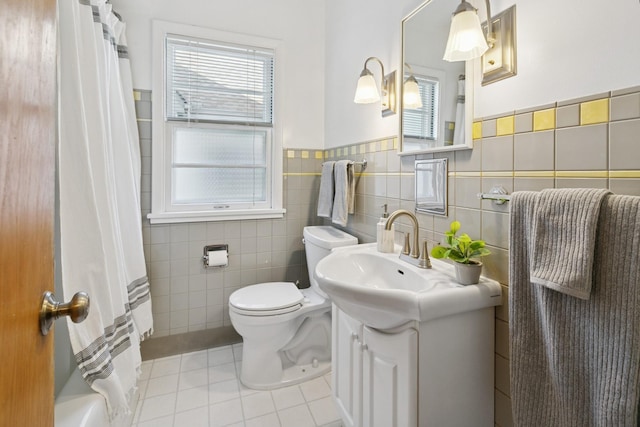 5409 Aldrich Ave S, Minneapolis, MN 55419 - bathroom featuring tile patterned floors, vanity, tile walls, a wainscoted wall, and curtained shower
