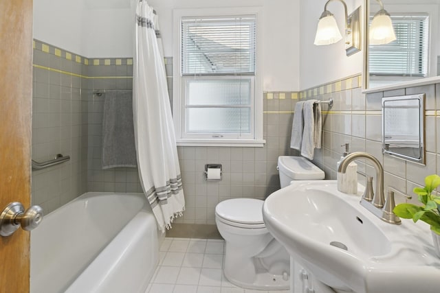 5409 Aldrich Ave S, Minneapolis, MN 55419 - full bathroom with tile patterned floors, tile walls, shower / bath combination with curtain, and a wainscoted wall