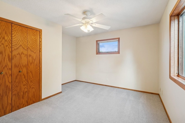 5409 Aldrich Ave S, Minneapolis, MN 55419 - unfurnished bedroom featuring light carpet, ceiling fan, and a closet