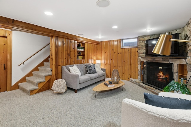 5409 Aldrich Ave S, Minneapolis, MN 55419 - carpeted living area with a stone fireplace, stairway, and wood walls