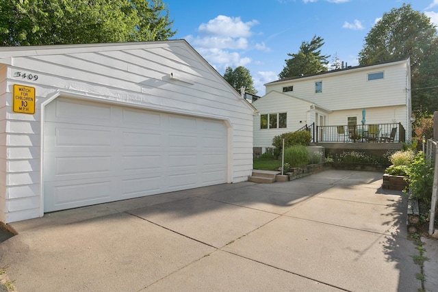 5409 Aldrich Ave S, Minneapolis, MN 55419 - view of front facade with a garage and an outdoor structure