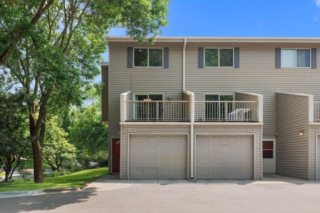 4100 Meadowlark Ln Unit 24100, Eagan, MN 55122 - view of property featuring a balcony and a garage