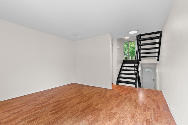 4100 Meadowlark Ln Unit 24100, Eagan, MN 55122 - unfurnished living room featuring wood finished floors and baseboards