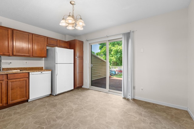 4100 Meadowlark Ln Unit 24100, Eagan, MN 55122 - kitchen with white appliances, brown cabinets, a sink, and a chandelier