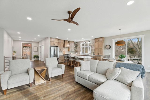 2401 Goldfinch Ln, Buffalo, MN 55313 - living area featuring healthy amount of natural light, wood finished floors, recessed lighting, and ceiling fan