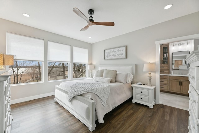 2401 Goldfinch Ln, Buffalo, MN 55313 - bedroom featuring dark wood-type flooring, ceiling fan, baseboards, recessed lighting, and ensuite bathroom