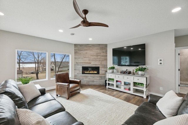 2401 Goldfinch Ln, Buffalo, MN 55313 - living room featuring ceiling fan, baseboards, recessed lighting, a tiled fireplace, and wood finished floors