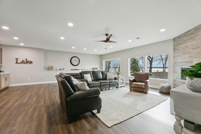 2401 Goldfinch Ln, Buffalo, MN 55313 - living room with recessed lighting, dark wood-style flooring, a tiled fireplace, ceiling fan, and baseboards