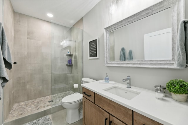 2401 Goldfinch Ln, Buffalo, MN 55313 - bathroom featuring toilet, vanity, tiled shower, and recessed lighting