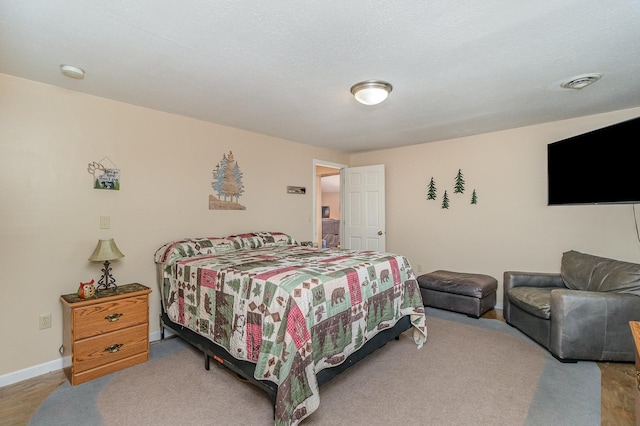 38630 Woodview Ln, Le Center, MN 56057 - bedroom with baseboards and wood finished floors